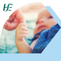 Baby holding an adult's thumb with HSE branding
