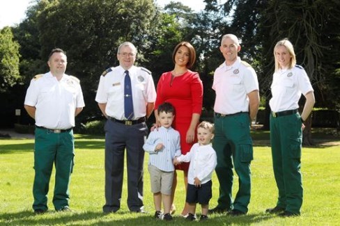 Emma Doyle and her children Henry and George Cardiac arrest survivor Emma Doyle and her children Henry and George with NAS personnel involved in her rescue