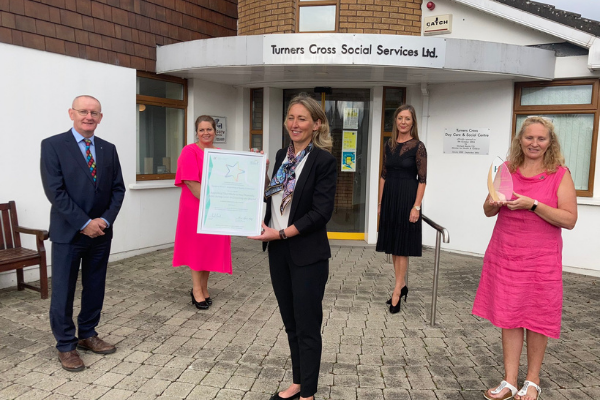 HSE Chief Officer, Cork Kerry Community Healthcare, Michael Fitzgerald presents the HSE Health Service Excellence Award to the team at Turners Cross Day Care Centre in Cork 