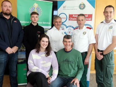 Sligo marathon runner Molua Donohoe sitting down beside his 18 year old daughter Alannah and the team of Community First Responders from Sligo. 