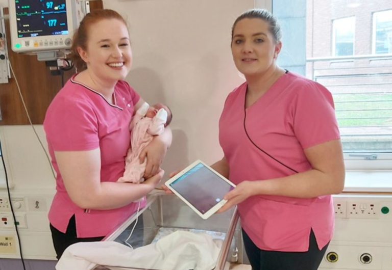 CUMH neonatal nurses Lorna Coleman and Cora Shorten with a NICU baby and the iPad.