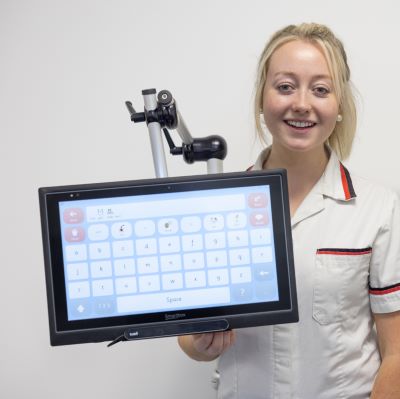 Sarah Rowland, Clinical Specialist Speech and Language Therapist at Tallaght University Hospital (TUH)  holding the eye-gaze communication device 