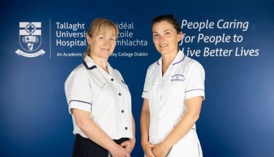 Eimear Lee Moloney Physio and Sarah Gill Dietitian stand against a blue background with Tallaght University Hospital branding