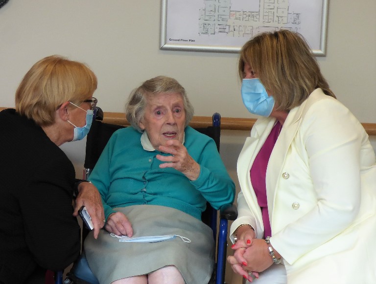 Minister Mary Butler engaging with staff and residents            