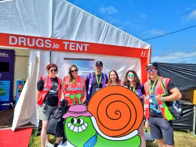 A group of people from the Safer Nightlife team standing outside the Drugs.ie festival tent.