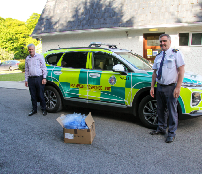 Gabriel Glynn, A/Assistant Chief Ambulance Officer, HSE West in receipt of modified gowns from Andy McDonnell, Training Centre Manager, Roscommon Mental Health Services, Community Healthcare West.