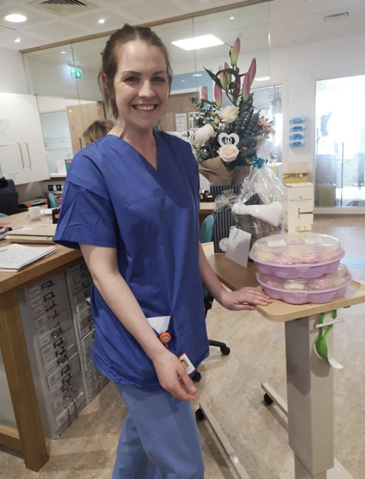 Aisling McGarrell on duty at Our Lady of Lourdes Hospital in Drogheda on what should have been her wedding day - pictured with a number of the gifts she received.