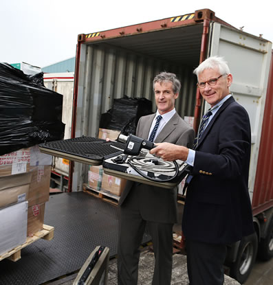 Prof Frank Murray, Consultant at Beaumont Hospital and Dr David Weakliam with container of medical equipment from Irish hospitals being shipped to Zambia (October 2014)