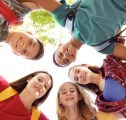 Group of young people standing in a circle