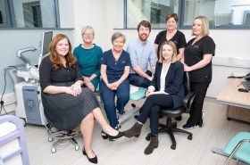 Large group of people in a clinical setting